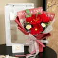 Detailed view of handmade crochet bouquet with red heart and flowers in a white gift bag - Cosmos Tulip Daisy Heart Gift Bag / Red