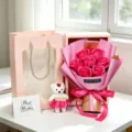 Detail view of a pink 7-rose soap flower gift box with small bear and matching gift bag. - Rose Red