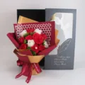 Soap flower bouquet detail shot, romantic red and white roses with elegant gift box packaging. - Grid Austin Pearl Bouquet + Feather Gift Box / Red