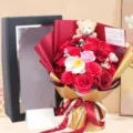 Detailed view of 18 red soap roses bouquet with plush bear in a luxury gift box - Bear Style Gift Box with 18 Red Manta Flowers / Without Handbag