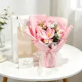 Close-up of handmade crochet rose bouquet with gift bag and greeting card. - Pink Open Tulip & Rose Bouquet / Window Bag