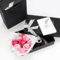 Close-up of 9 artificial soap roses in a black gift box with a greeting card. - 9 Pieces (With Gift Box Tote Bag Greeting Card) / Rose Pink