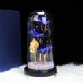 Detail view of the eternal blue rose glass dome with LED string lights and base for romantic gifts. - 3 Gold Foil Roses + USB Cable / Blue