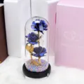Blue foil rose glass dome gift with LED lights and colorful base, romantic decor closeup. - 3 Gold Foil Roses / Blue