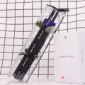 Detailed view of a single purple soap rose in a long PVC box with a black ribbon - Rose Purple