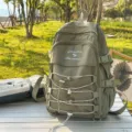Large capacity minimalist army green backpack for students and outdoor travel use - With Pendant / Green