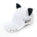 Detail shot of white baseball cap showing metal rings on brim and punk safety pin charms. - Adult 55-58cm / Safety Pin Airplane White