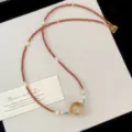 Close-up of New Chinese style yellow quartz necklace with pearls and red faceted beads - Natural Citrine Freshwater Pearl Red Beaded Necklace (R2916)