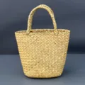 Detailed close-up view of the woven straw tote bag showing fine texture and sturdy double handles. - 16*11cm / Handheld Basket