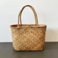Close-up detail of a handmade seagrass woven basket showing natural straw texture - 30x15x24cm / Natural (Thick Handle No Leather)