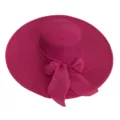 Detailed view of a fuchsia rose red wide brim straw sun hat with a large decorative bow - Adult 55-58cm / Rose Red