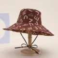 Brown wide brim bucket hat for women with stylish white letter and heart print for summer beach. - English Alphabet Brown