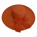 Close-up view of a vibrant orange wide-brim straw hat with an elegant ribbon bow detail. - Adult 55-58cm / Orange