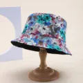 Detailed view of reversible sun hat with vibrant floral print pattern and black lining - Multicolor