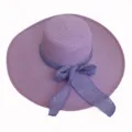 Top view of elegant purple wide brim straw sun hat featuring a decorative bowknot ribbon - Adult 55-58cm / Purple