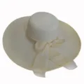 Detail view of the elegant cream wide-brimmed straw sun hat with a matching ribbon bow - Adult 55-58cm / Cream