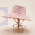 Pink plaid wide brim bucket hat detail view, foldable sun protection beach cap for women. - Plaid Orange