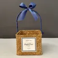 Handmade square straw woven gift basket with elegant blue ribbon handle and bow detail - Orange Basket (Navy Blue Ribbon)