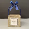 Detailed view of a handmade square woven gift basket featuring an elegant blue ribbon bow - White-Washed Basket [Navy Blue]
