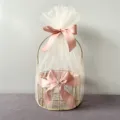 Gold wire gift basket with white tulle and pink ribbon for weddings and Mother's Day. - Round Basket / Nude Pink Snow Yarn
