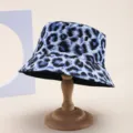Stylish blue leopard print bucket hat on a wooden display stand, double-sided design - Adult 55-58cm / Leopard Print (Reversible) / Blue Leopard Print