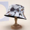 Detail view of a stylish reversible floral bucket hat shown on a wooden display stand - Blue Abstract Floral