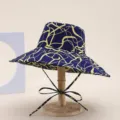 Stylish women's wide brim bucket hat with blue and yellow abstract print for summer outdoor sun. - Water Ripple Blue