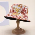 Detailed view of a double-sided bucket hat with vibrant autumn leaf print pattern - Adult 55-58cm / Autumn Leaves Print Style (3) / Autumn Leaves Print