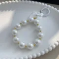 Elegant white iridescent pearl bead charm with white bow for phone, keys or bag strap - Cream White
