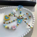 Handmade colorful beaded phone charm with star and heart shapes in sweet candy colors - Multicolor