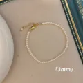 Minimalistisches 3mm Perlenarmband in Weiß mit verstellbarem goldenem Karabinerverschluss - Armband / 3mm / Weiß