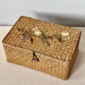 Detail view of a hand-woven rectangular storage box featuring elegant floral embroidery - Rectangular Medium (26*16*9) x Golden Rose