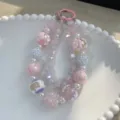 Sweet pink hand-painted donut beaded phone strap featuring colorful jelly beads and clasp - Donut Pink White Beads (A35) / Pink & White
