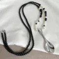 Macro detail of creative silver spoon pendant necklace with black and white beads - Pearl Spoon Style (ML1227) / Silver/Black/White