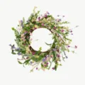 Macro view of a spring wildflower wreath with pink and purple blossoms on grapevine. - Small Flower Wreath With Balls
