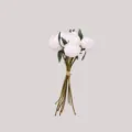 Detail of white artificial peony bouquet showing realistic flower buds and green leaves. - White