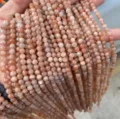 Detailed close-up view of natural orange sunstone round beads for DIY jewelry making - 3A Moonstone Round Bead (26TJY02) / 5mm / Orange
