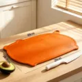 Antibacterial vibrant orange pig-shaped TPU cutting board for household kitchen - Vitality Orange Cutting Board / Vibrant Orange