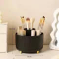 Black rotating makeup brush holder with gold feet, 14x13.5cm elegant desktop organizer - Black