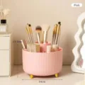 Professional pink rotating makeup brush organizer with gold accents for vanity - Pink