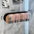 Modern wall-mounted toothbrush rack with 4 transparent cups and wood grain detail. - 4-Cup Set / 4-Cup Holder Walnut