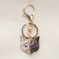 Retro fox mask keychain with black and white enamel and blue rhinestone accents - Black and White