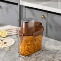 Airtight brown plastic cereal storage container with handle and clear measuring lid - Small (5019) / 21.5x20x10cm / Brown