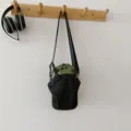 Green grid outdoor shoulder phone bag with black mesh pocket for hiking and camping use. - One Size / Green