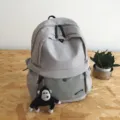 Large capacity grey school backpack, casual solid color daily bag with monkey charm. - One Size / Gray