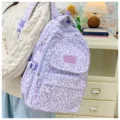 Lavender leopard print backpack worn by a student in a cozy indoor setting view - Purple