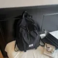 Minimalist black student backpack with high capacity for school and casual travel - Black