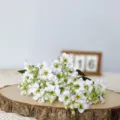 Close-up of artificial white tung flower bouquet, silk fabric material for home decor. - White