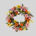 Detailed close-up view of colorful artificial daisy and sunflower wreath for home decor. - Colorful