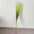 Detailed macro view of artificial green PE long-leaf scallion grass plant for home decor - Green